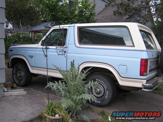 1985 Ford Bronco parked on driveway, side view