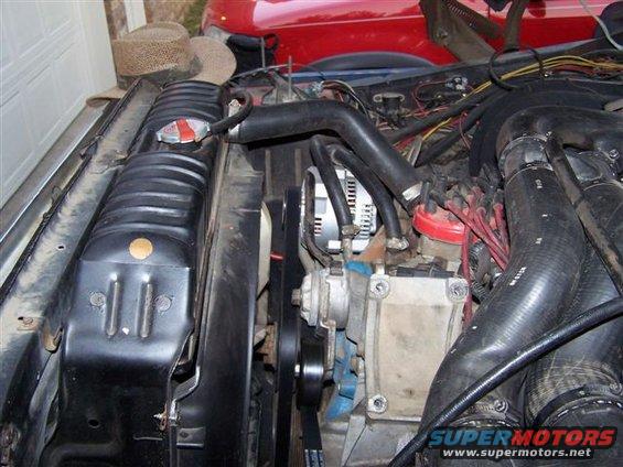Engine bay showing radiator, fan, and engine components