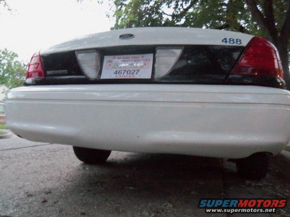 White police car rear with "488" on trunk lid and Kansas license plate