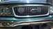 1999 Ford Expedition - Close-up of the front grille and headlights of a 1999 Ford Expedition.