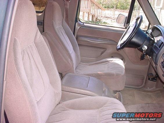 Tan cloth bucket seats and dashboard of a 1992 Ford Bronco