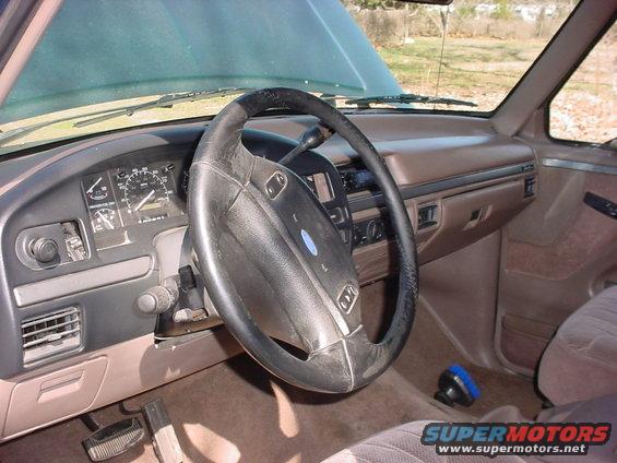 1992 Ford Bronco interior with brown dashboard and steering wheel