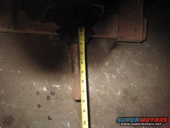 Driveshaft with a yellow measuring tape indicating its length