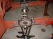 1964 Ford Fairlane - Close-up of a car's front suspension system, showing the chassis and various metal parts.