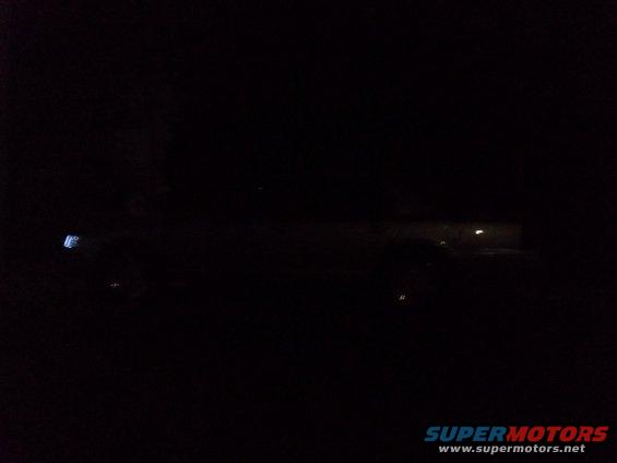 Side view of a 2000 Mercury Grand Marquis sedan at night