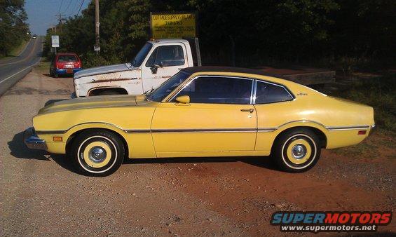 Yellow 1973 Ford Maverick coupe, side view