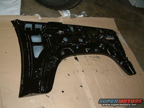 Black fender inner structure on cardboard