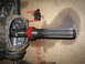 1979 Chevrolet C/K Pickup - Close-up of a driveshaft component with a red gear and bolts, likely removed for repair.
