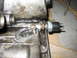 1979 Chevrolet C/K Pickup - This is a close-up view of an oil pressure sensor installed on an engine block, showing mechanical components.