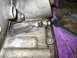 1979 Chevrolet C/K Pickup - Detail of an engine block, showing a bolt and a metal clip attached to the casing.