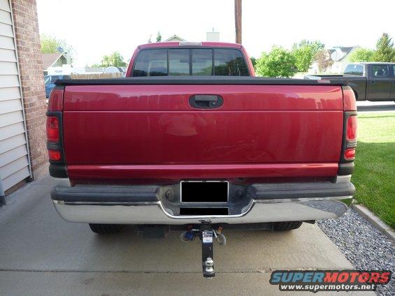 Red 1997 Dodge 2500 rear view with trailer hitch