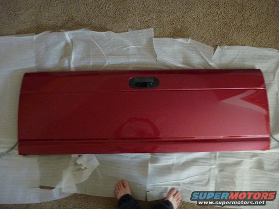 red pickup truck tailgate with black handle