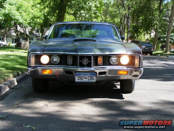 Front view of a 1970 Mercury Cougar with a hood scoop and a Colorado license plate reading 396 CBG