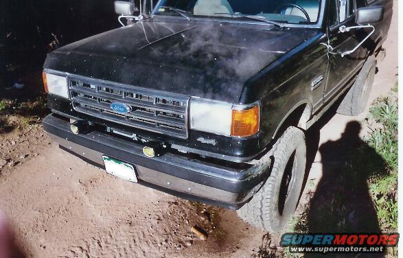 overheat.jpg Oxygen is thin at such high altitudes and my freshly changed thermostat couldnt handle it...yes that is antifreez on the ground and their is steam.