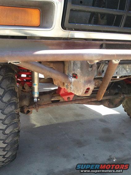 1982 Ford Bronco front suspension with custom bumper and red coil springs