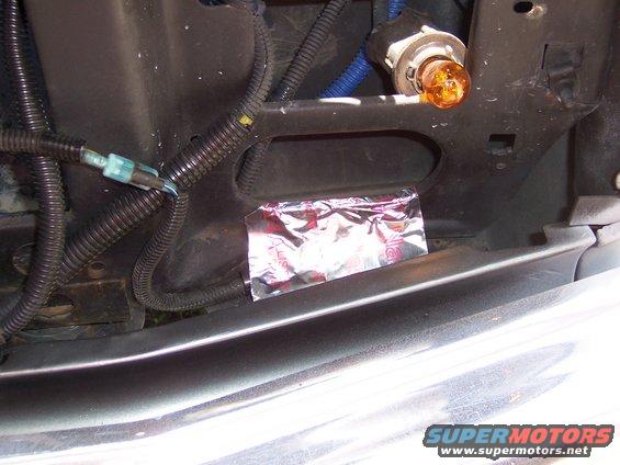 temperature-sensor-003.jpg to prevent any possible windchill problems, I made a bridge over the sensor with a piece fo metal duct tape.  The position alone should accomplish this, but I wanted to make sure that air wouldn't be blowing directly on the sensor.