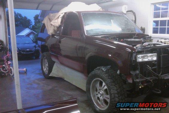 Maroon 1994 Chevrolet Blazer, front end disassembled, in garage