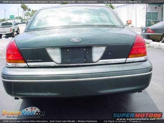 Rear view of a 1998 Ford Crown Victoria Police Interceptor. Taillights and Ford emblem visible