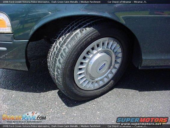 1998 Ford Crown Victoria police interceptor wheel and dark green fender