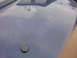 2002 Ford Crown Victoria - The hood of a blue vehicle shows three circular indentations, with a Supermotors.net watermark visible in the lower right corner.