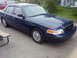 2002 Ford Crown Victoria - Put full wheel covers on.