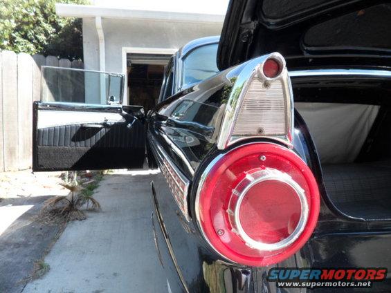1956 Ford Fairlane rear with distinctive tail light and open door