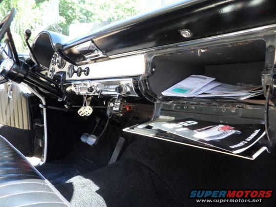 1956 Ford Fairlane interior with owner's manual in glove box
