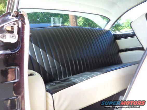 1956 Ford Fairlane interior rear seat with black pleated vinyl and white vinyl bolsters