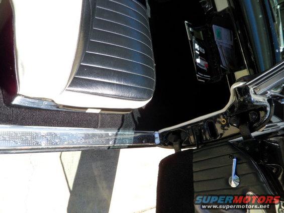 1956 Ford Fairlane interior with black and white seats and door panel