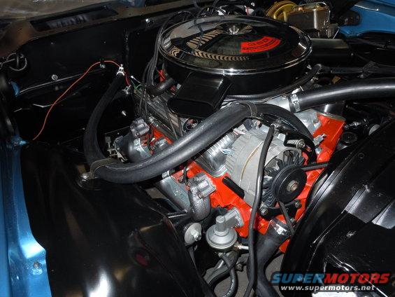 1972 Chevrolet Camaro engine bay with chrome air cleaner and orange block