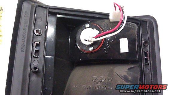 strobebulbmounted.jpg Excursions and some E series vans have a third (top) unused reflector.  Drilled a 1" hole and two screw mount holes and mounted a Whelen strobe unit with Show-Me bulbs.