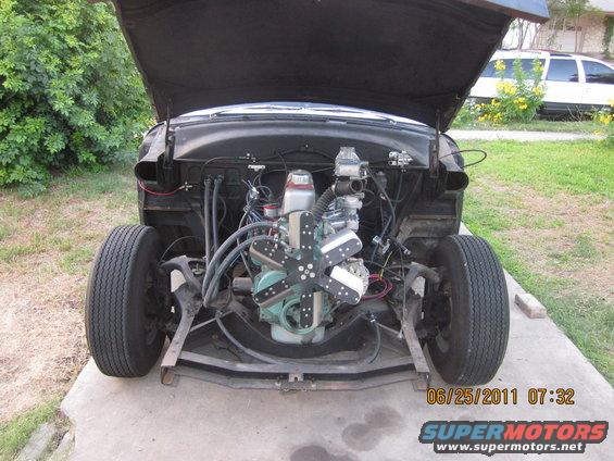 Car with hood up showing engine and front suspension. Date stamp reads 06/25/2011