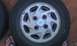 1991 Ford Festiva - A close-up view of a wheel the Ford logo on its center cap.