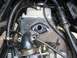 2008 Yamaha Zuma - This image shows a close-up view of internal engine components and associated hoses on a motorcycle.