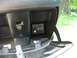 2008 Yamaha Zuma - A battery and alternator condition tester is visible inside a vehicle's compartment.