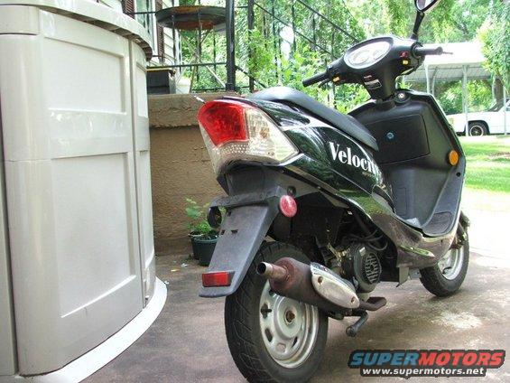 Black scooter's rear view with "Velocity" text