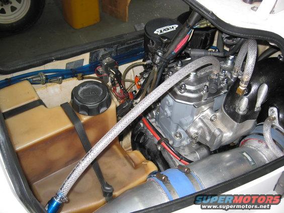 Jet ski engine compartment with fuel tank and engine components visible