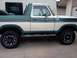 1978 Ford Bronco - This 1978 Ford Bronco features a distinctive two-tone green and white paint scheme and side running boards.