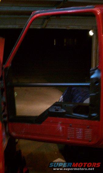1994 Ford F-250 door frame, red exterior, black interior structure visible