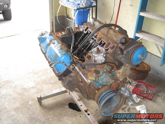 Ford V8 engine on an engine stand, appears to be disassembled