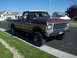 1979 Ford F-150 - This 1979 Ford F-150 pickup truck features a two-tone brown and tan paint scheme and a prominent chrome grille.