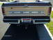 1979 Ford F-150 - The rear of a 1979 Ford F-150 pickup truck, showing the tailgate with 'FORD' lettering and an Idaho license plate.