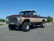 1979 Ford F-150 - This 1979 Ford F-150 pickup truck features a two-tone brown and tan paint scheme and lifted suspension.