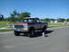 1979 Ford F-150 - A 1979 Ford F-150 pickup truck is shown from a three-quarter front angle on a sunny day.
