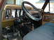 1979 Ford F-150 - The interior of a 1979 Ford F-150 shows its dashboard, steering wheel, and seating.