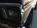 1979 Ford F-150 - Close-up of the front passenger side of a 1979 Ford F-150, showing the headlight and fender.