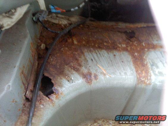 rusted interior car panel with wiring harness
