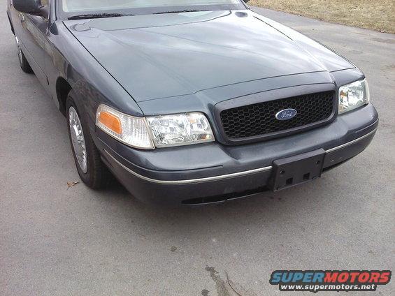 Dark gray 2000 Ford Crown Victoria front end with honeycomb grille and chrome trim
