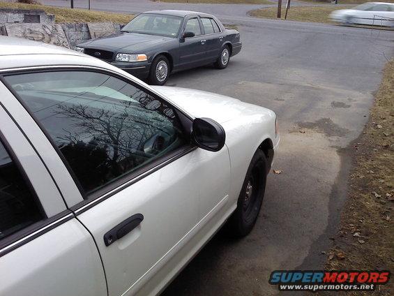 White 2000 Ford Crown Victoria front quarter panel and door