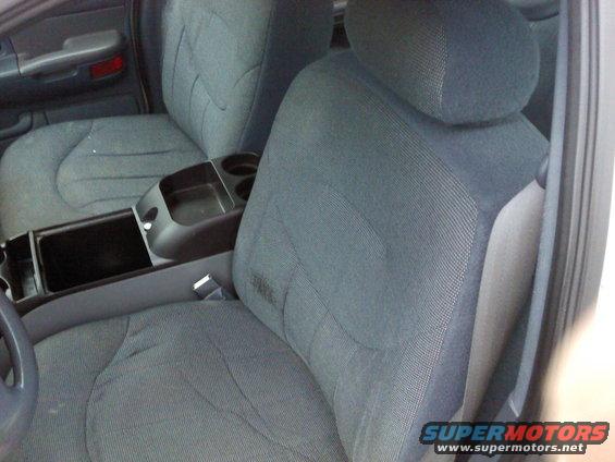 2000 Ford Crown Victoria interior showing front cloth seats and center console with cup holders